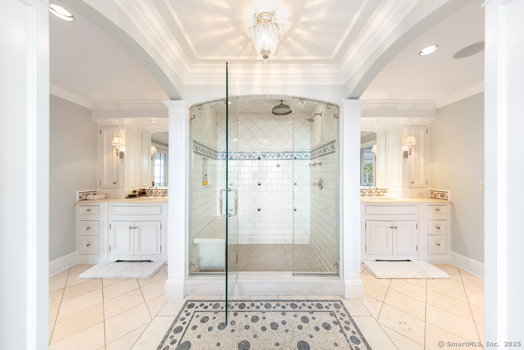 260 Hillspoint Road Westport, CT 06880 - Photo 18 of 40 a bathroom with a shower sink and mirror