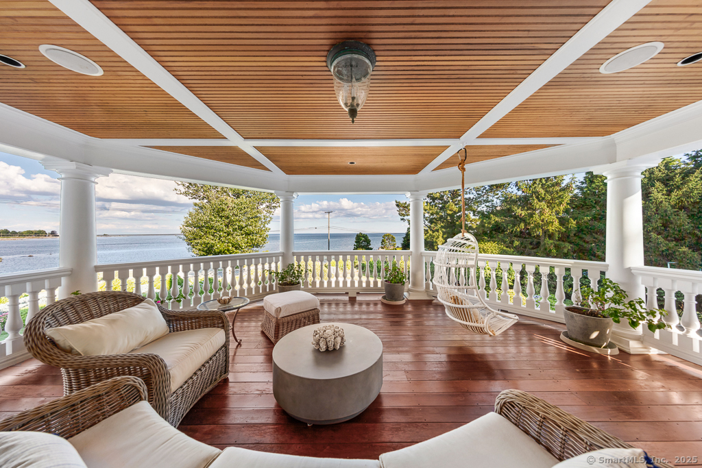 260 Hillspoint Road Westport, CT 06880 - Photo 20 of 40 a balcony with furniture and a large window