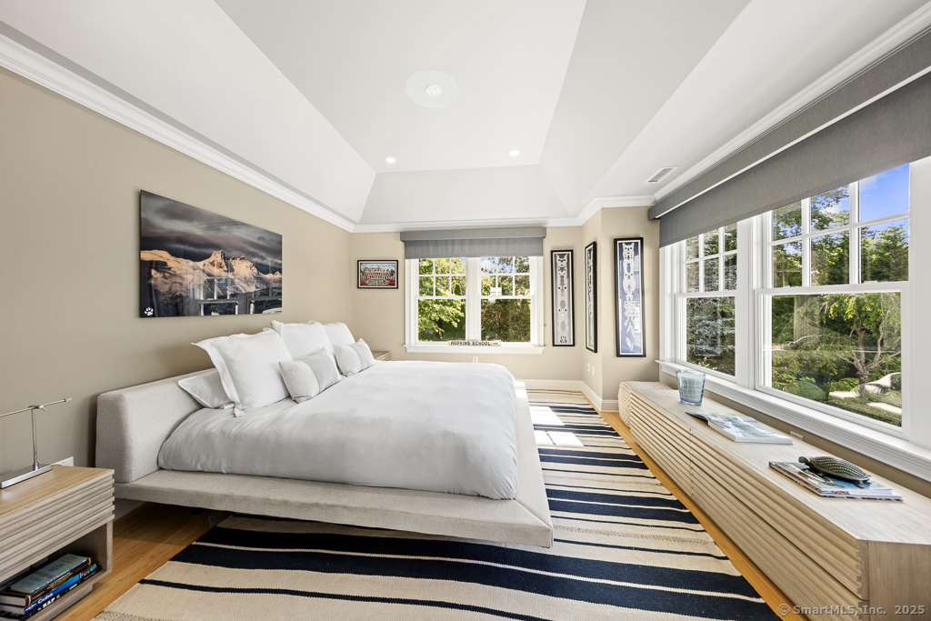 260 Hillspoint Road Westport, CT 06880 - Photo 24 of 40 a bedroom with bed and wooden floor