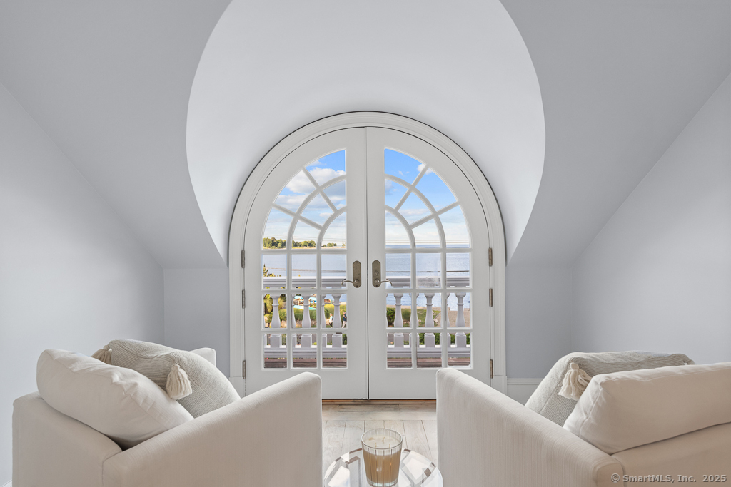 260 Hillspoint Road Westport, CT 06880 - Photo 25 of 40 a living room with furniture and a large window