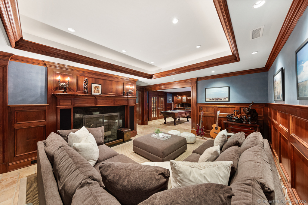 260 Hillspoint Road Westport, CT 06880 - Photo 28 of 40 a living room with furniture and a fireplace