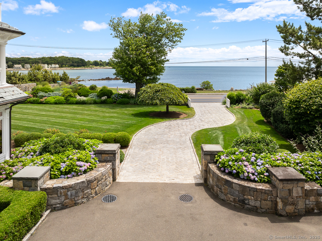 260 Hillspoint Road Westport, CT 06880 - Photo 34 of 40 a view of a garden with a fountain