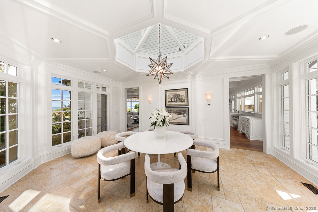 260 Hillspoint Road Westport, CT 06880 - Photo 6 of 40 a view of a dining room with furniture and a chandelier