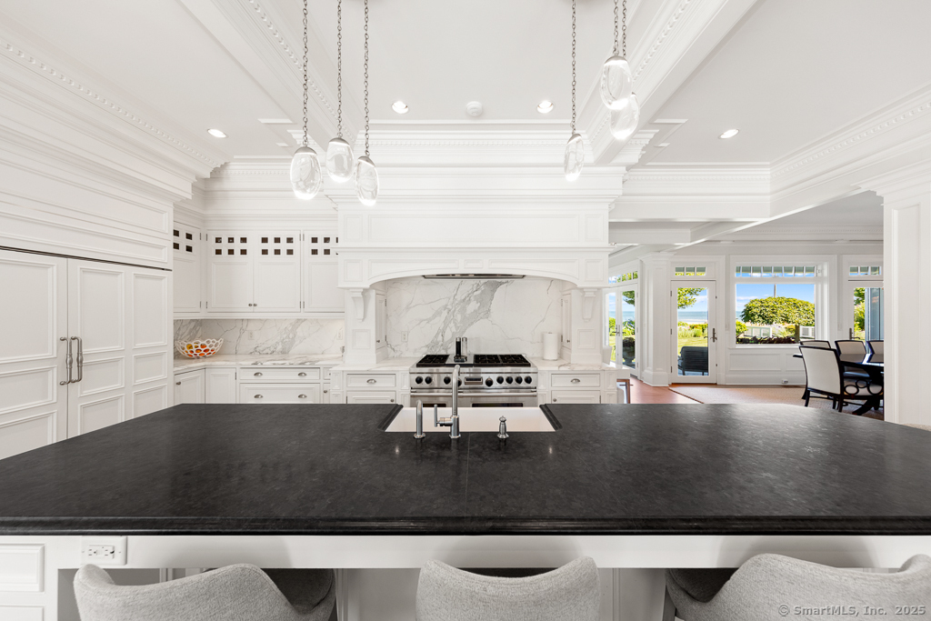 260 Hillspoint Road Westport, CT 06880 - Photo 9 of 40 a living room with furniture and a chandelier