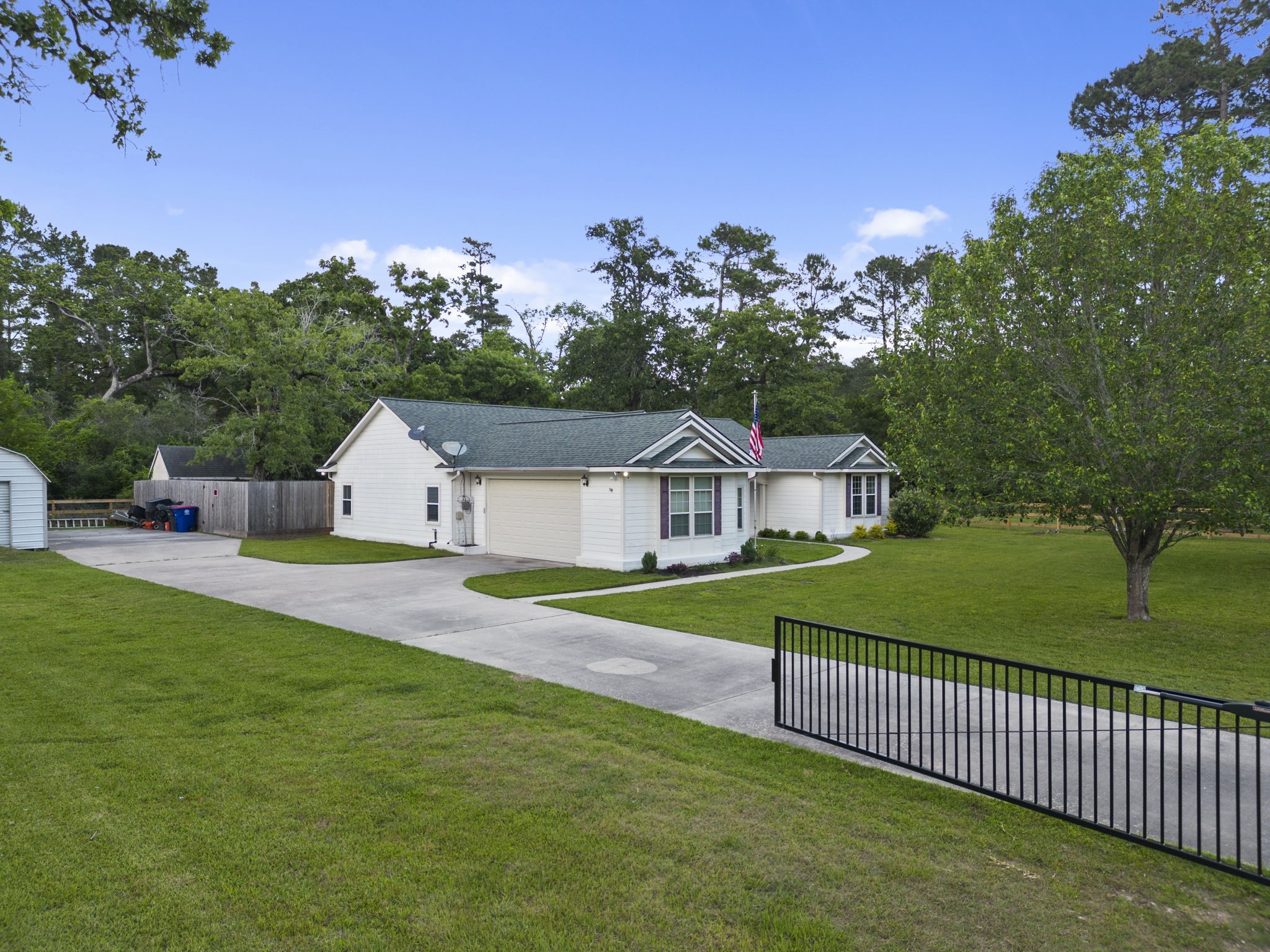 23200 Baneberry Road Magnolia, TX 77355 - Photo 2 of 39 a view of a backyard with a garden