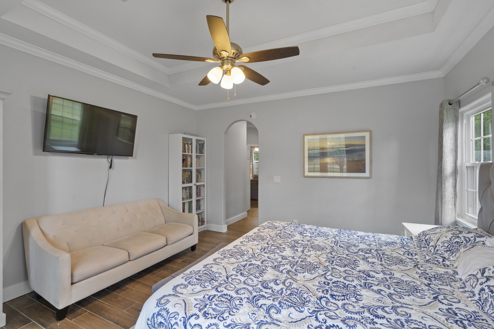 23200 Baneberry Road Magnolia, TX 77355 - Photo 22 of 39 a bedroom with a bed couch and a flat screen tv