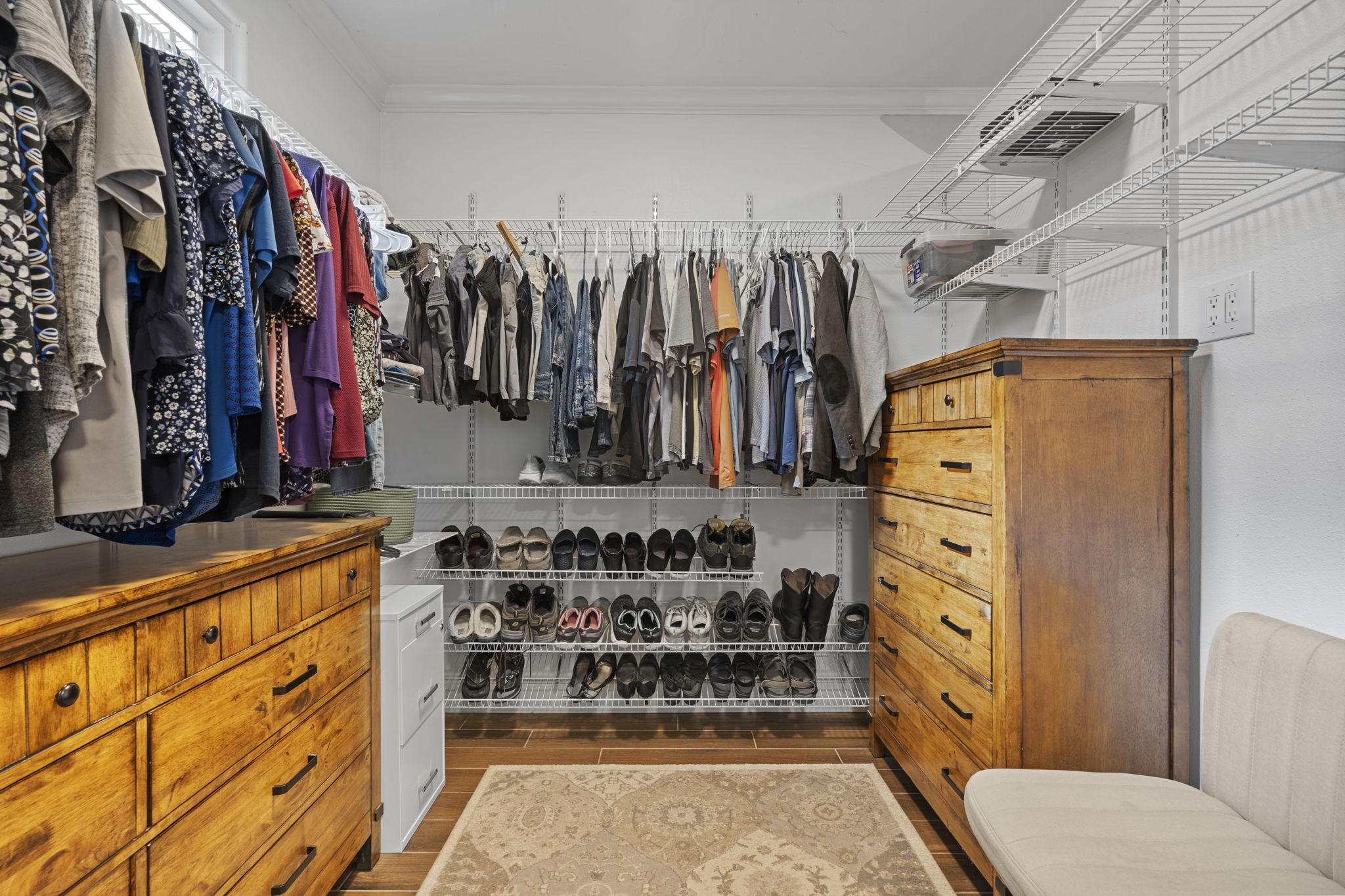 23200 Baneberry Road Magnolia, TX 77355 - Photo 28 of 39 a view of walk in closet with clothes and shoes