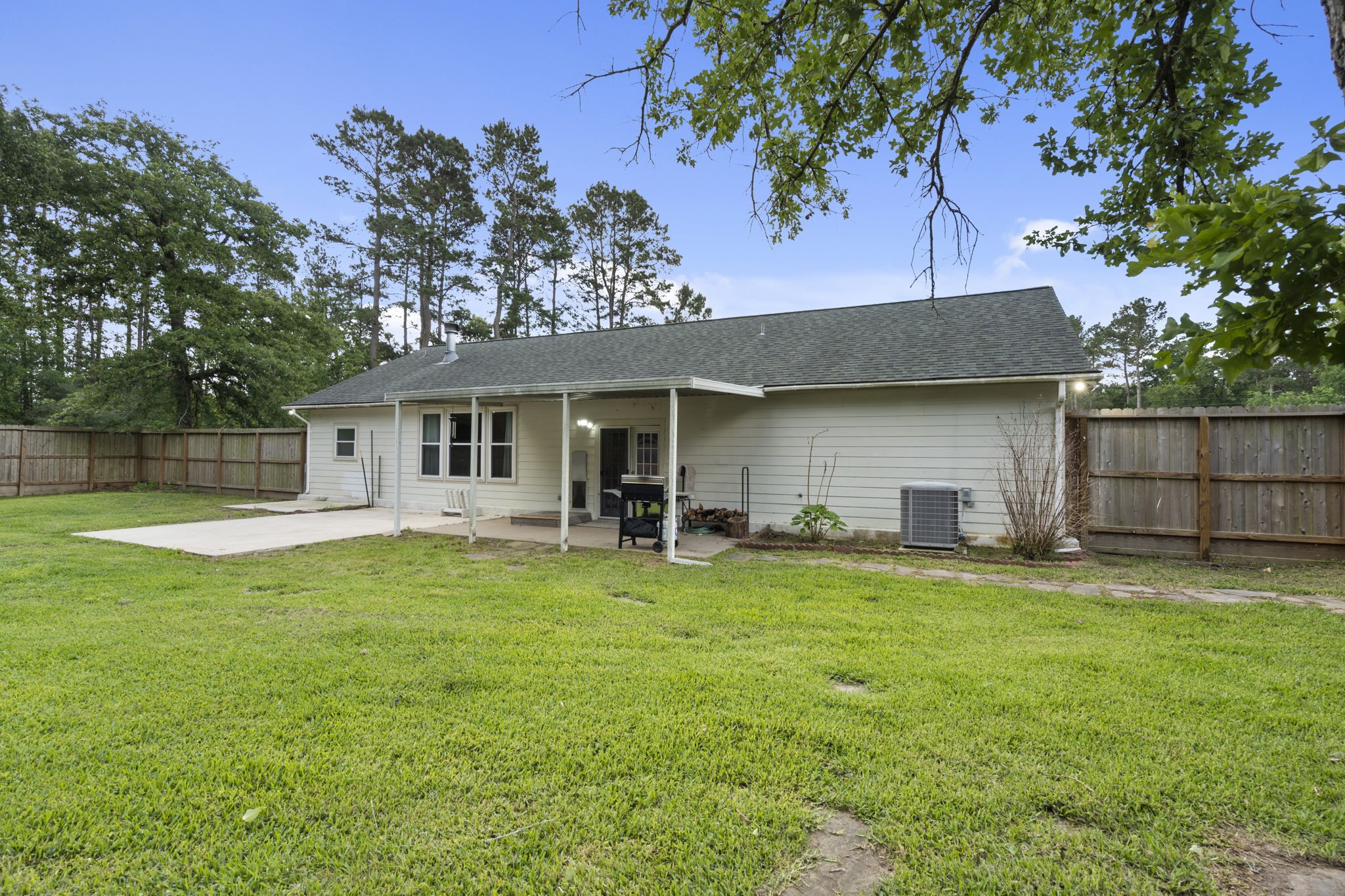 23200 Baneberry Road Magnolia, TX 77355 - Photo 33 of 39 a front view of a house with a garden and porch