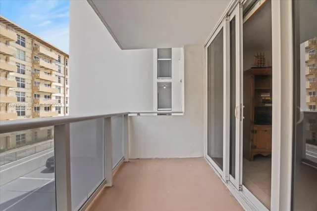 a view of walk in closet with empty room