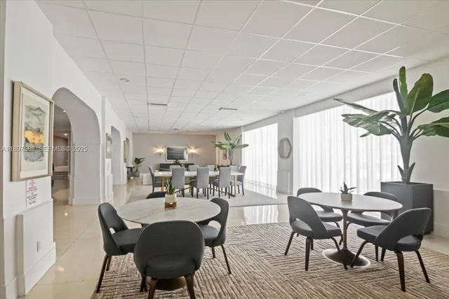 a view of a dining room with furniture window and outside view
