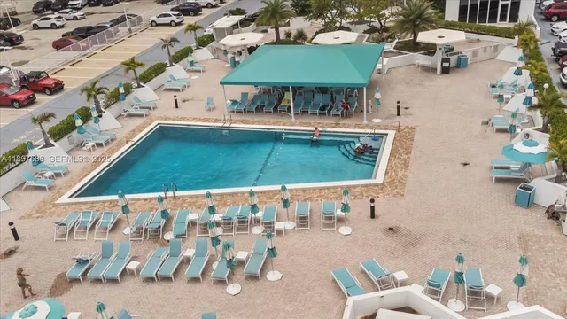 an aerial view of a house with a swimming pool