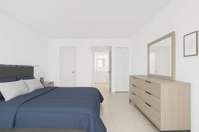 a bedroom with a bed and a mirror