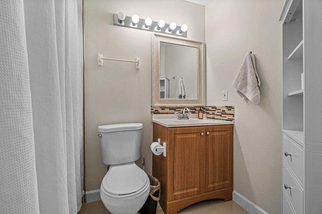 241 Meadows Drive Boynton Beach, FL 33436 - Photo 19 of 24 a bathroom with a toilet and a sink