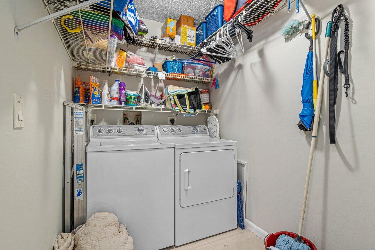 241 Meadows Drive Boynton Beach, FL 33436 - Photo 22 of 24 a utility room with dryer and washer
