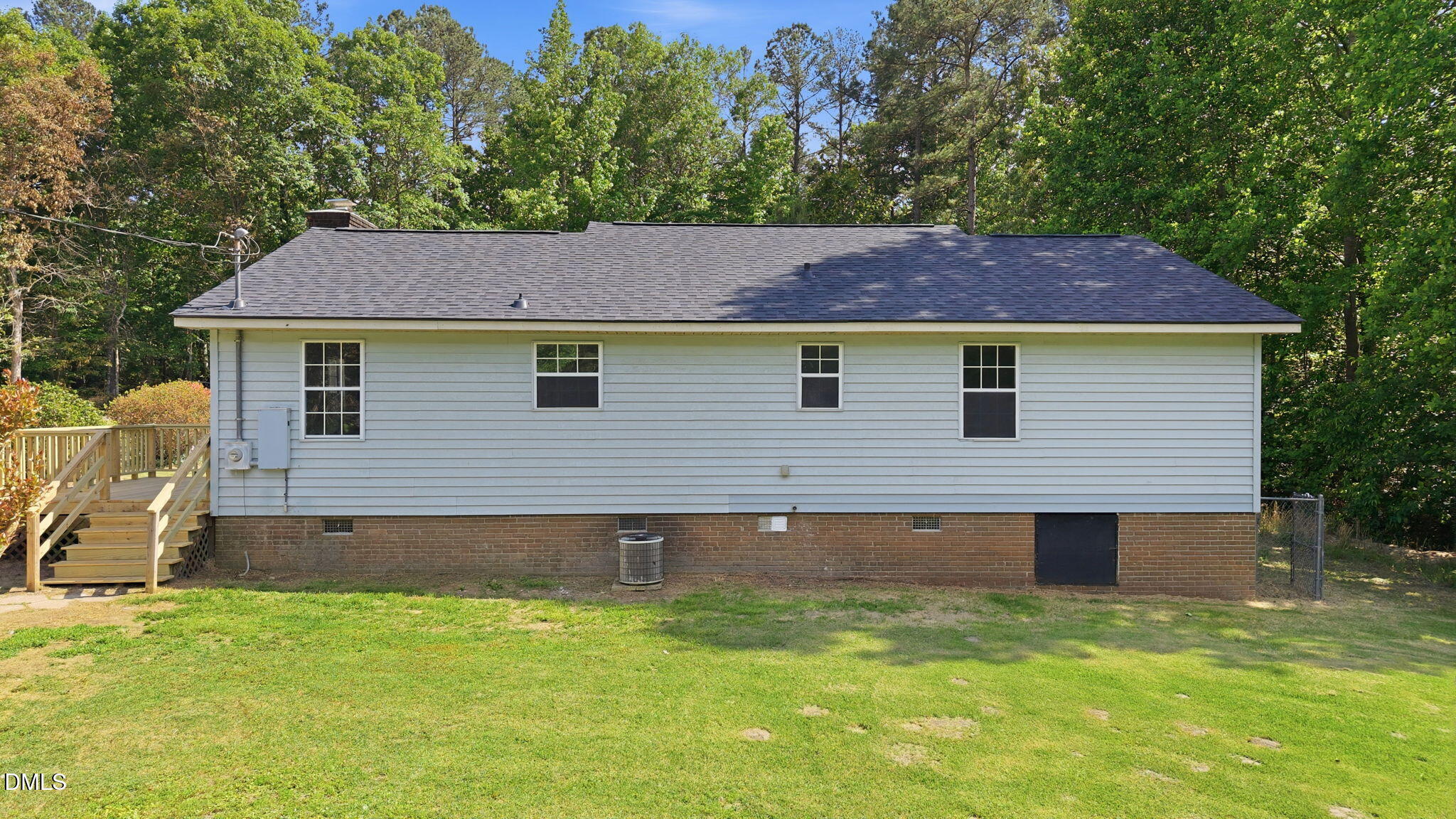 3602 Harrison Road Castalia, NC 27816 - Photo 9 of 48 a backyard of a house with table and chairs