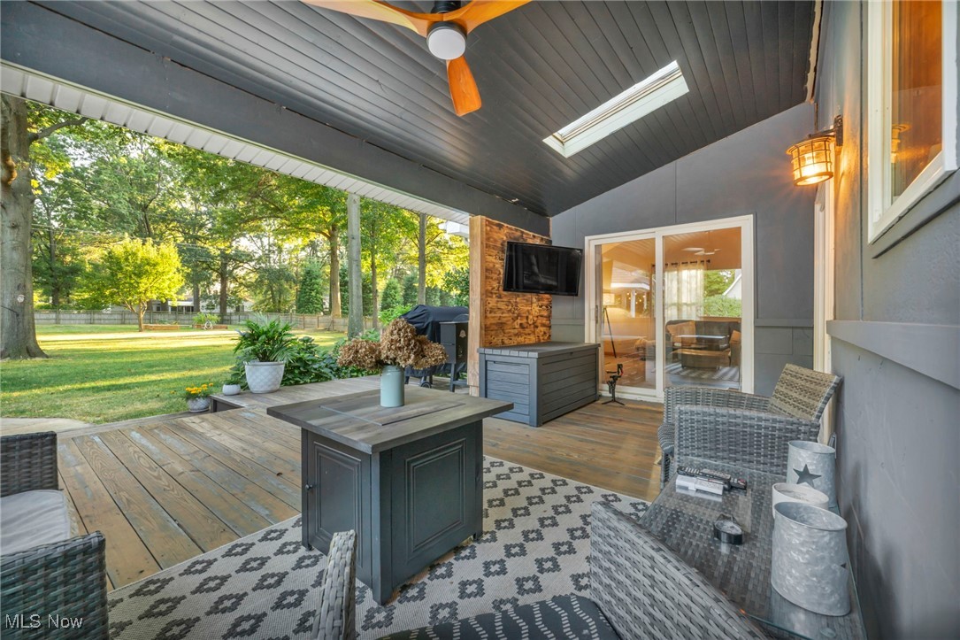 14902 Kneisel Road Vermilion, OH 44089 - Photo 45 of 49 Deck featuring ceiling fan and a lawn