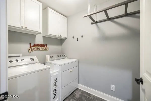 a view of storage and utility room with washer and dryer