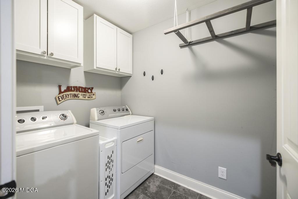 137 Shady Oak Drive Perry, GA 31069 - Photo 13 of 37 a view of storage and utility room with washer and dryer