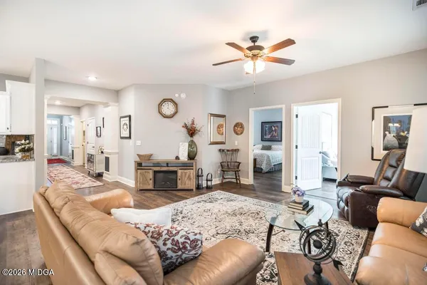 a living room with furniture and a large window