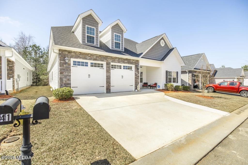 137 Shady Oak Drive Perry, GA 31069 - Photo 2 of 37 a view of multiple houses with a street