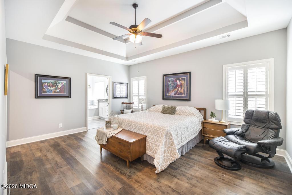 137 Shady Oak Drive Perry, GA 31069 - Photo 22 of 37 a spacious bedroom with a bed couch and a large window