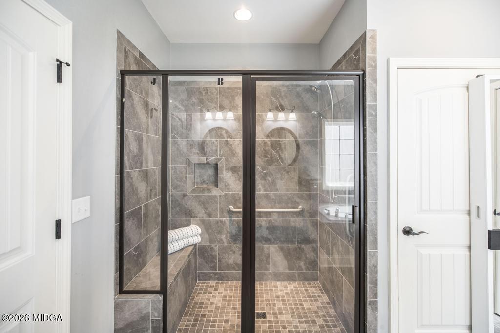 137 Shady Oak Drive Perry, GA 31069 - Photo 26 of 37 a bathroom with a glass shower door
