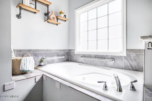 a bathroom with a sink and a bathtub
