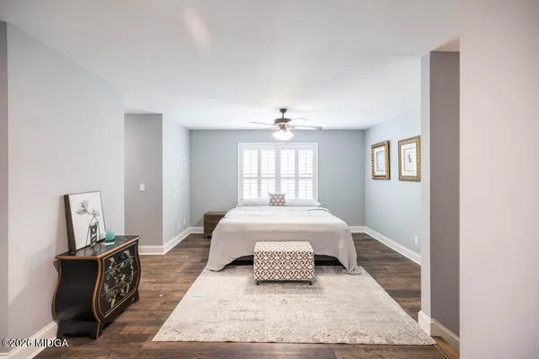 a living room with furniture rug and window