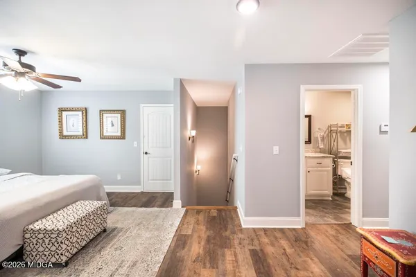a bedroom with a bed and a view of bathroom