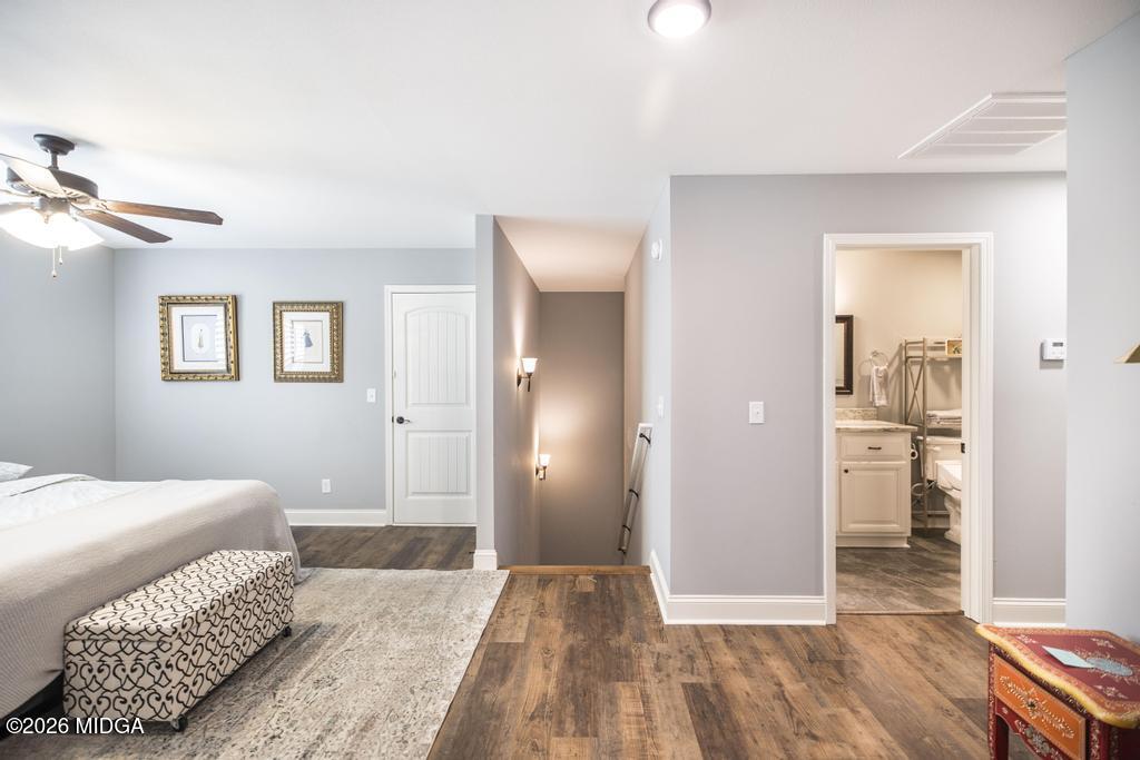 137 Shady Oak Drive Perry, GA 31069 - Photo 31 of 37 a bedroom with a bed and a view of bathroom