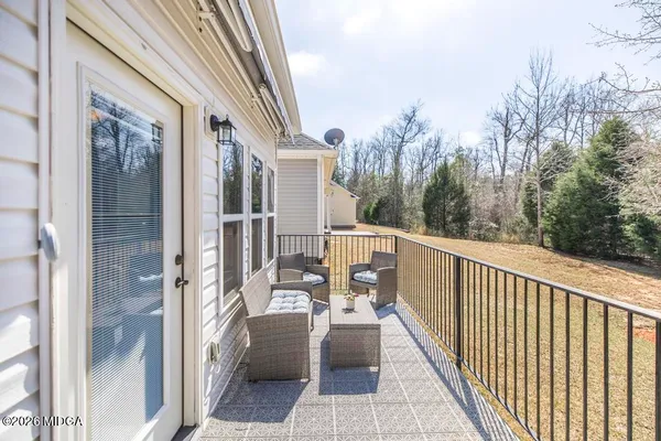 a view of balcony with furniture