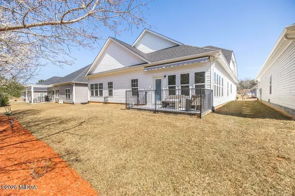 front view of a house with swimming pool and porch