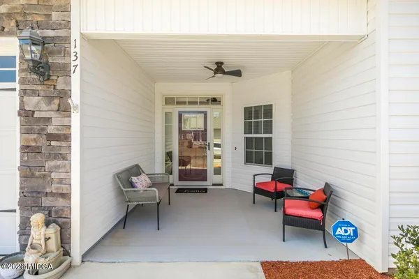 a living room with furniture and a window