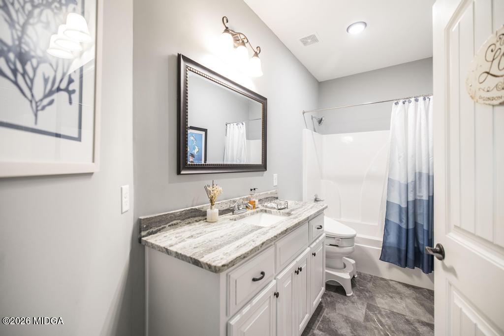 137 Shady Oak Drive Perry, GA 31069 - Photo 8 of 37 a bathroom with a double vanity sink and a mirror