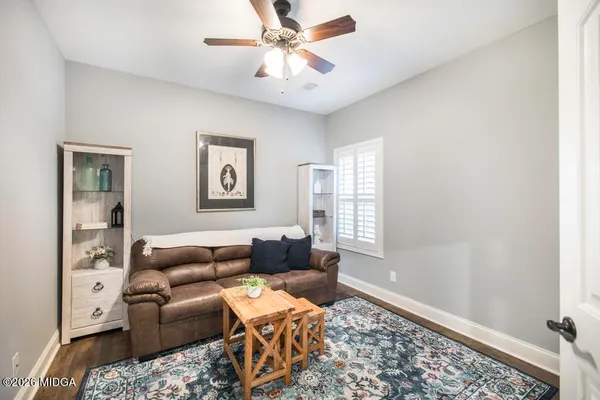 a living room with furniture and a window