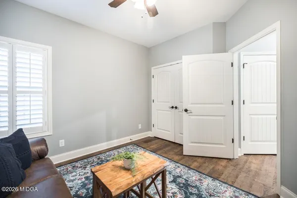 a view of a livingroom with furniture and white walls