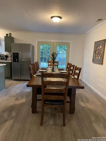 a dining room with furniture and window