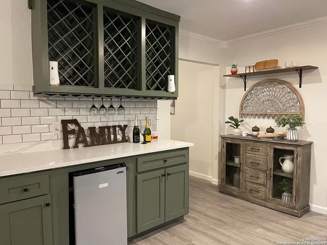 a kitchen with stainless steel appliances a stove and a sink
