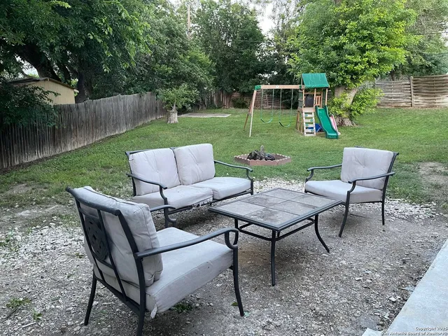 a view of a sitting area with furniture and garden