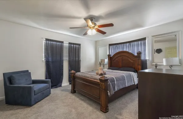 a bedroom with a bed and a couch