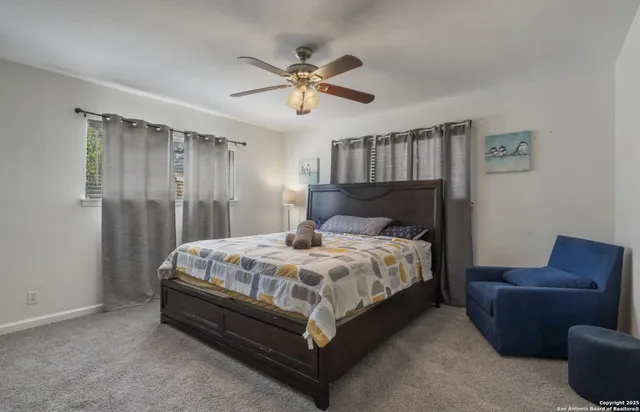 a bedroom with a bed and a couch