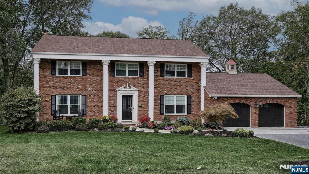 23 Erli Street Wayne, NJ 07470 - Photo 1 of 49 a aerial view of a brick house next to a yard