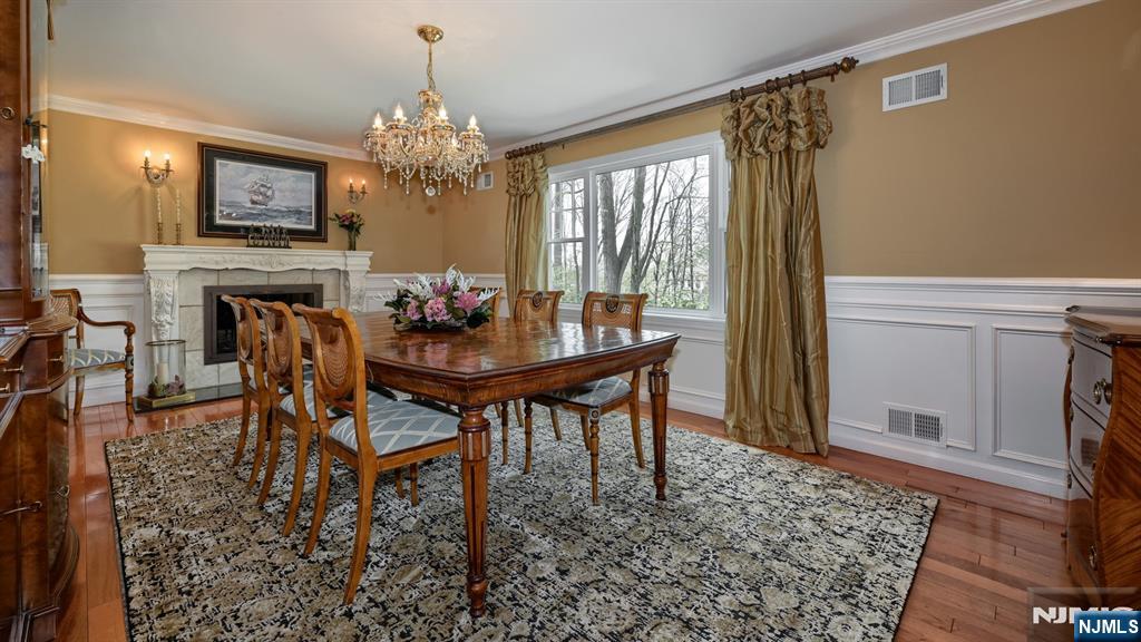 23 Erli Street Wayne, NJ 07470 - Photo 11 of 49 a view of a dining room with furniture and a chandelier