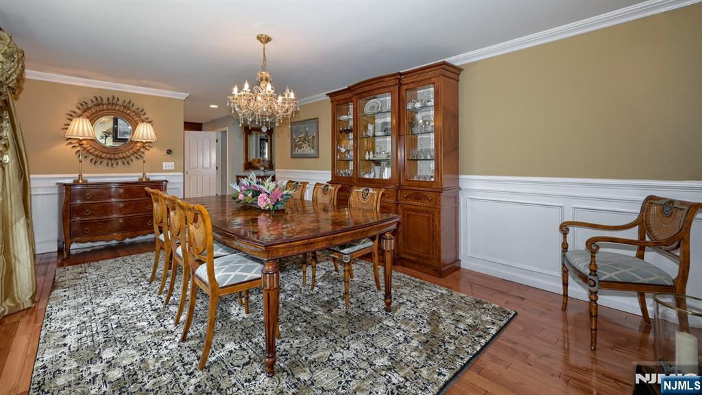 23 Erli Street Wayne, NJ 07470 - Photo 12 of 49 a view of a dining room with furniture and a chandelier