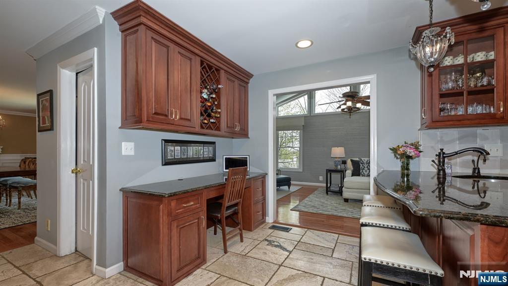 23 Erli Street Wayne, NJ 07470 - Photo 17 of 49 a kitchen with stainless steel appliances granite countertop a sink stove and cabinets