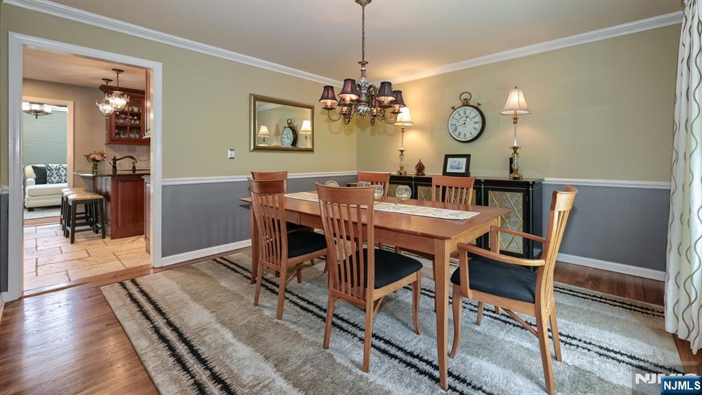 23 Erli Street Wayne, NJ 07470 - Photo 19 of 49 a view of a dining room with furniture and wooden floor