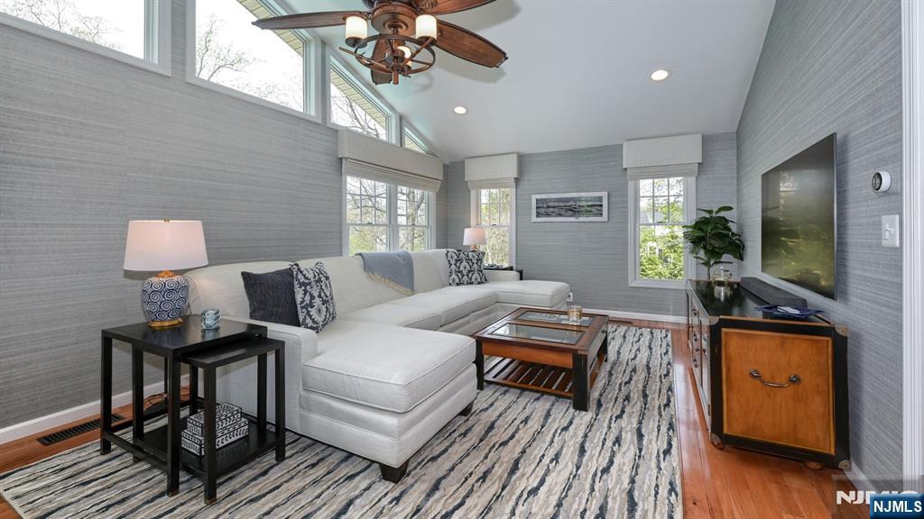 23 Erli Street Wayne, NJ 07470 - Photo 22 of 49 a living room with furniture and a flat screen tv