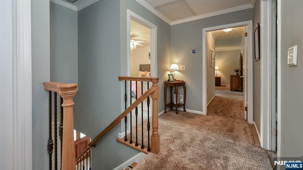 23 Erli Street Wayne, NJ 07470 - Photo 25 of 49 a view of a livingroom with a hall and stairs