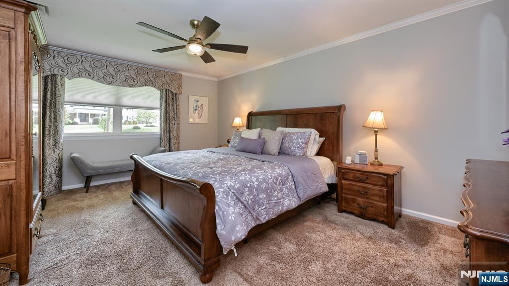 23 Erli Street Wayne, NJ 07470 - Photo 26 of 49 a bedroom with a bed and a window