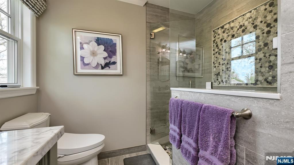 23 Erli Street Wayne, NJ 07470 - Photo 29 of 49 a bathroom with a toilet a sink and a shower